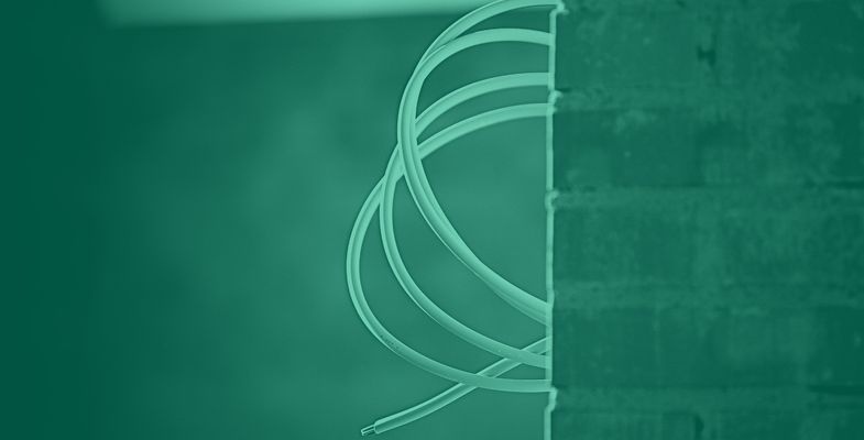Low voltage cable installed in a brick wall